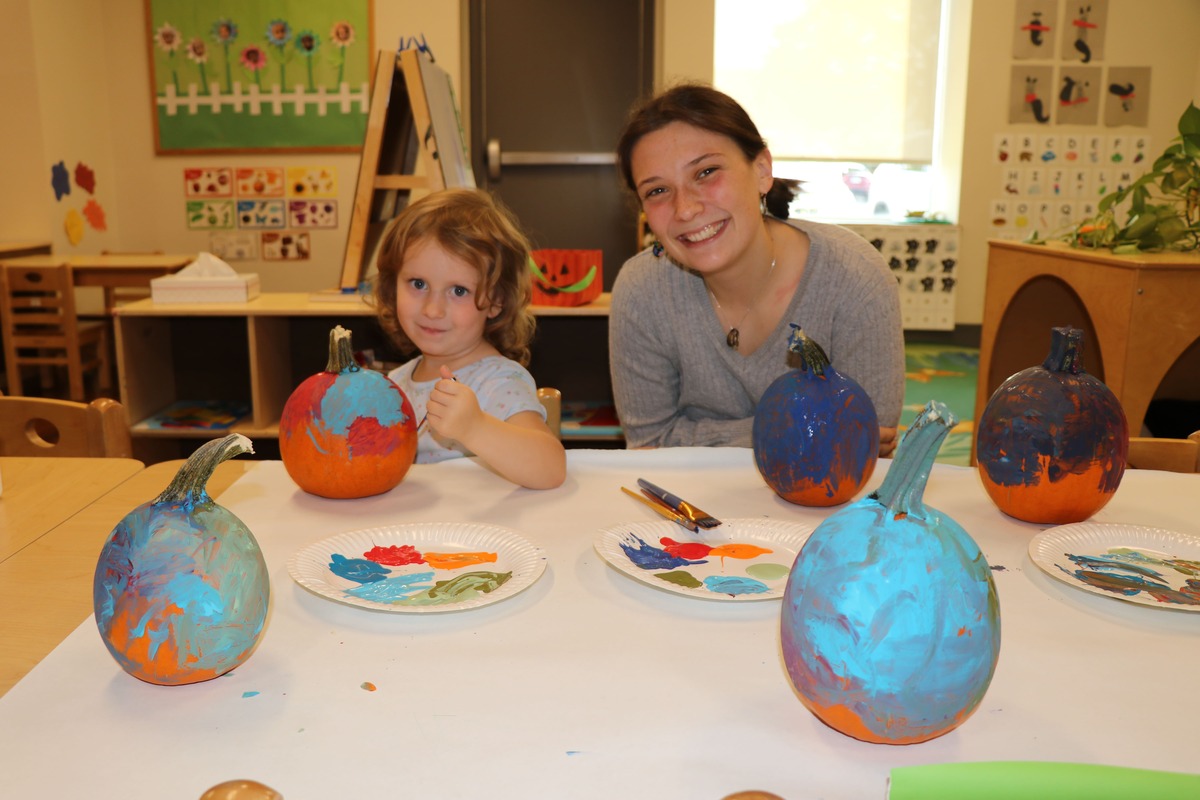 Early childhood centers of excellence teacher and student painting in class
